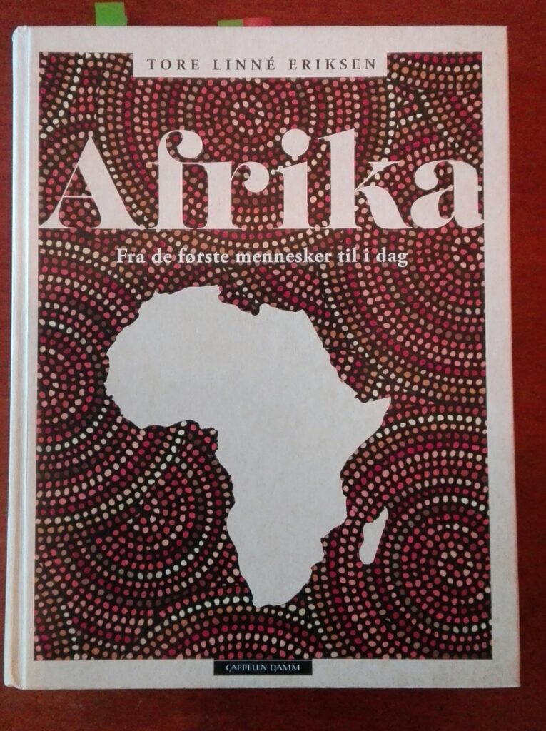 Omslaget til boka Afrika, fra de første mennesker til i dag, av Tore Linné Eriksen. Omslaget viser omrisset av det afrikanske kontinentet.